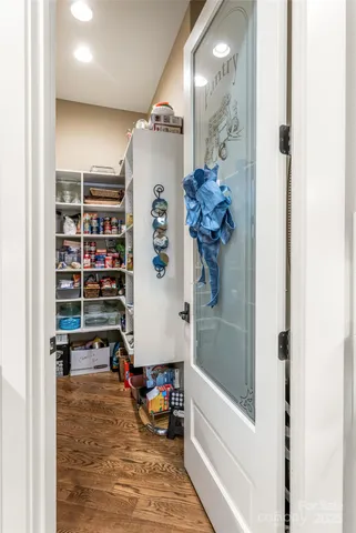 a view of a hallway with a dining table