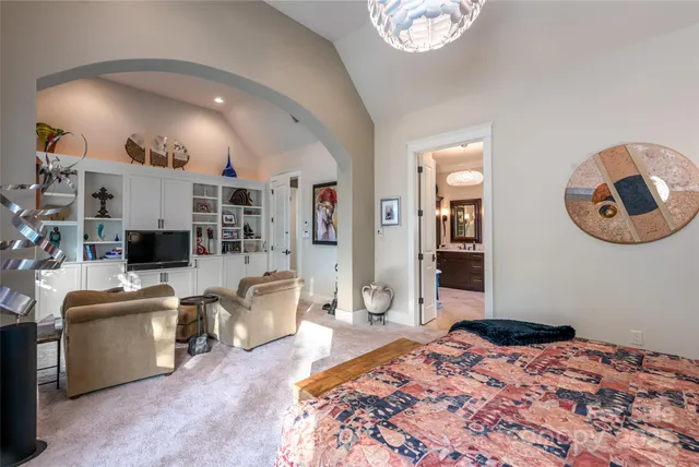 a view of bathroom with a tub shower and mirror