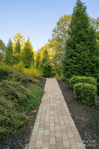 an aerial view of a house with a yard swimming pool outdoor seating and yard