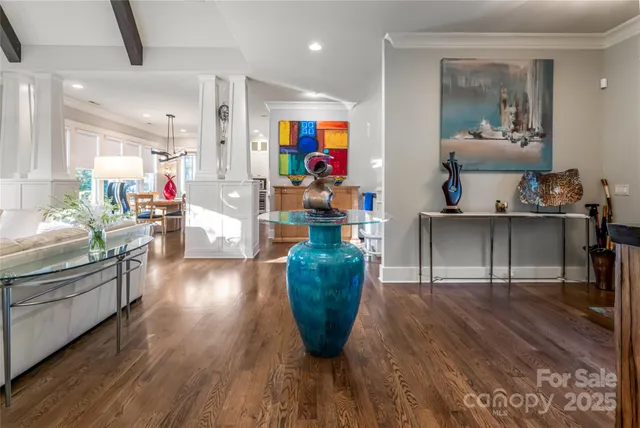 a living room with kitchen island furniture and a wooden floor