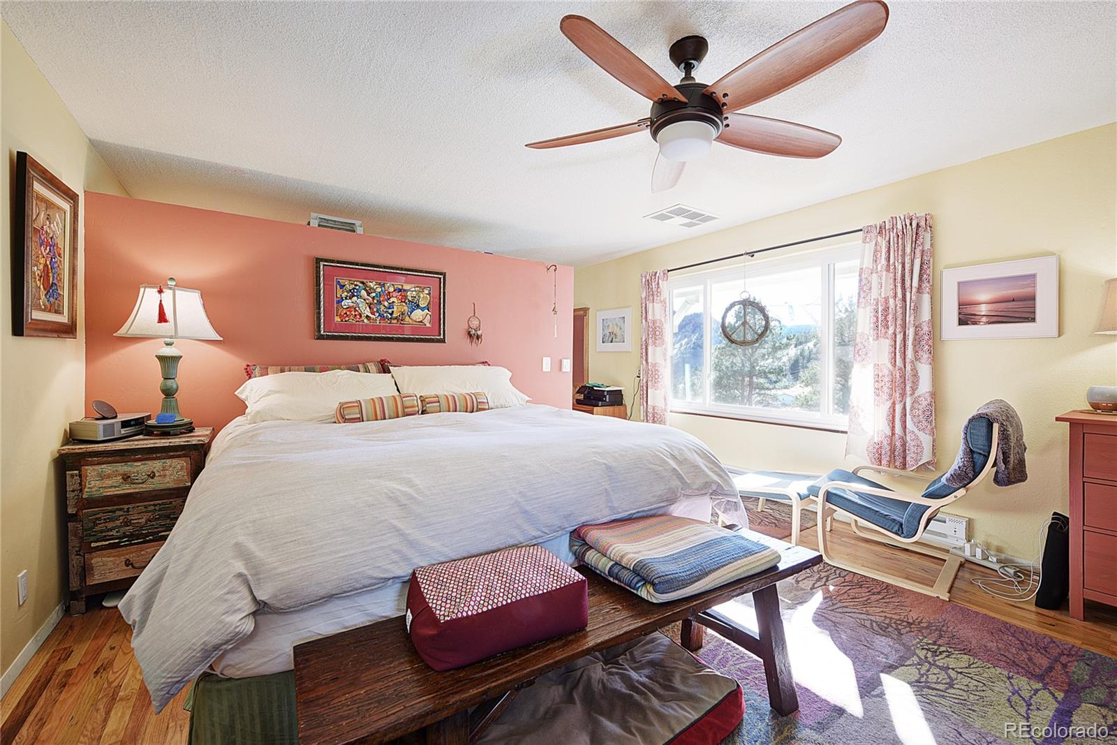 5384 Olde Stage Road Boulder, CO 80302 - Photo 12 of 28 a bedroom with a bed a desk and chair