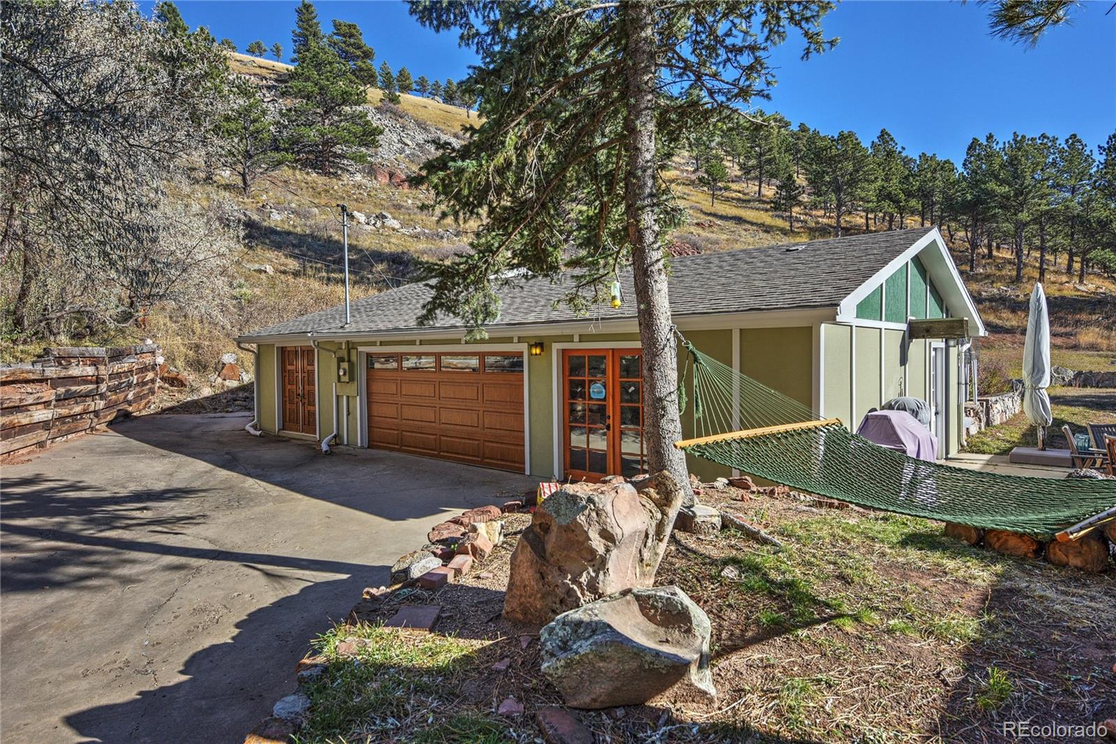 5384 Olde Stage Road Boulder, CO 80302 - Photo 16 of 28 a front view of a house with garden