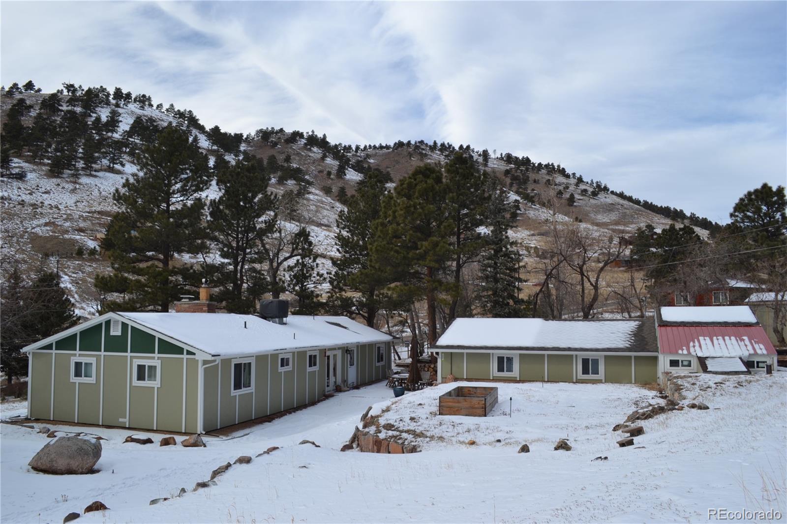 5384 Olde Stage Road Boulder, CO 80302 - Photo 23 of 28 a front view of a house with a yard and parking space