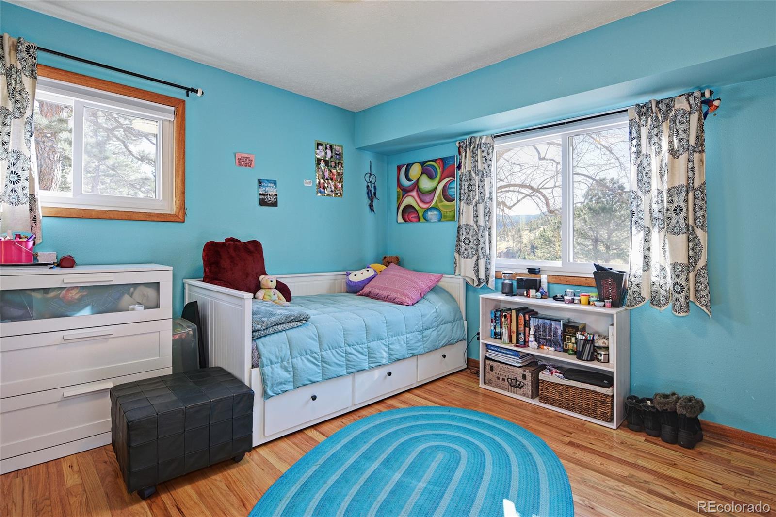 5384 Olde Stage Road Boulder, CO 80302 - Photo 8 of 28 a bedroom with a bed and a large window