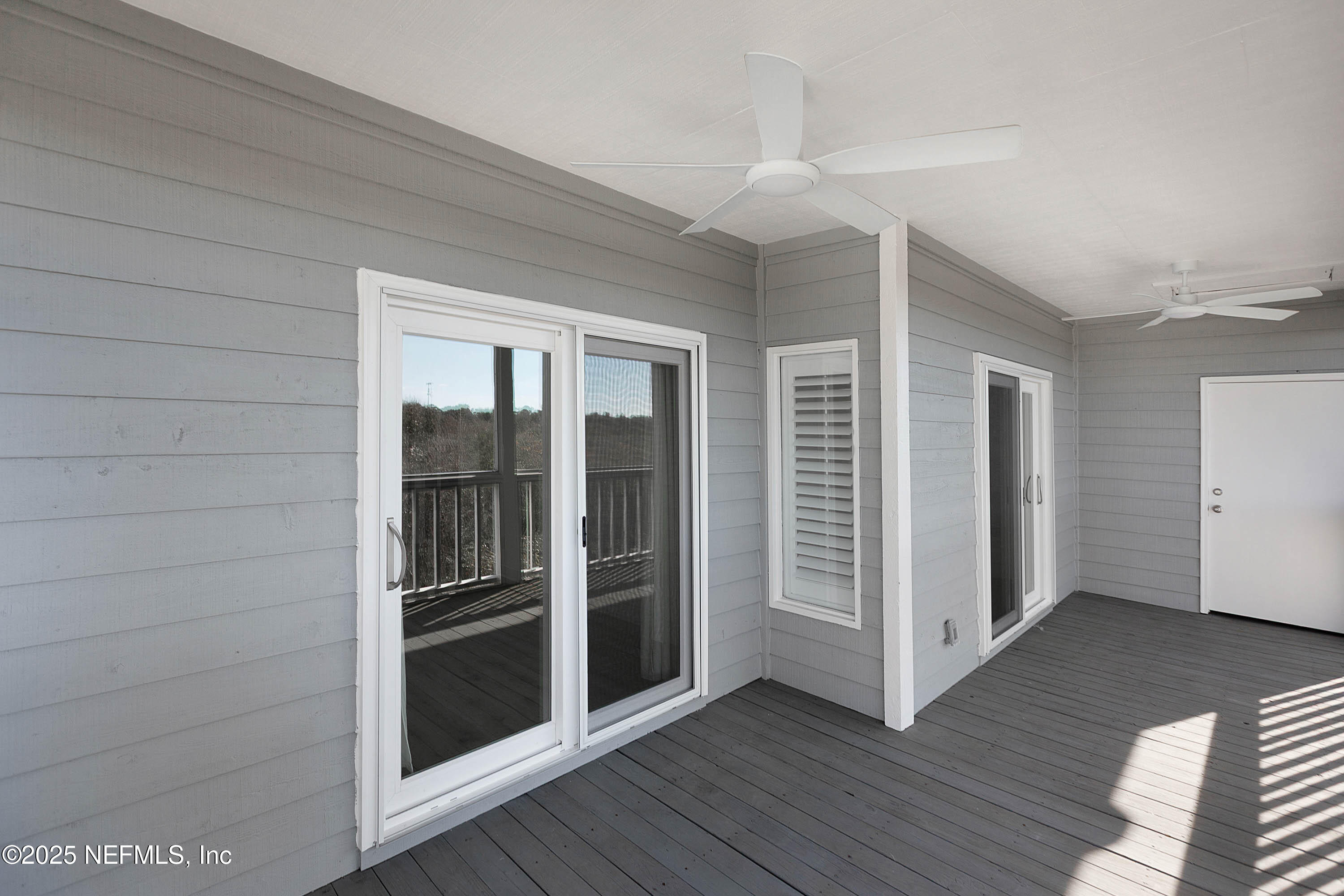 624 Ponte Vedra Boulevard, Unit C8 Ponte Vedra Beach, FL 32082 - Photo 11 of 26 an empty room with wooden floor closet and windows