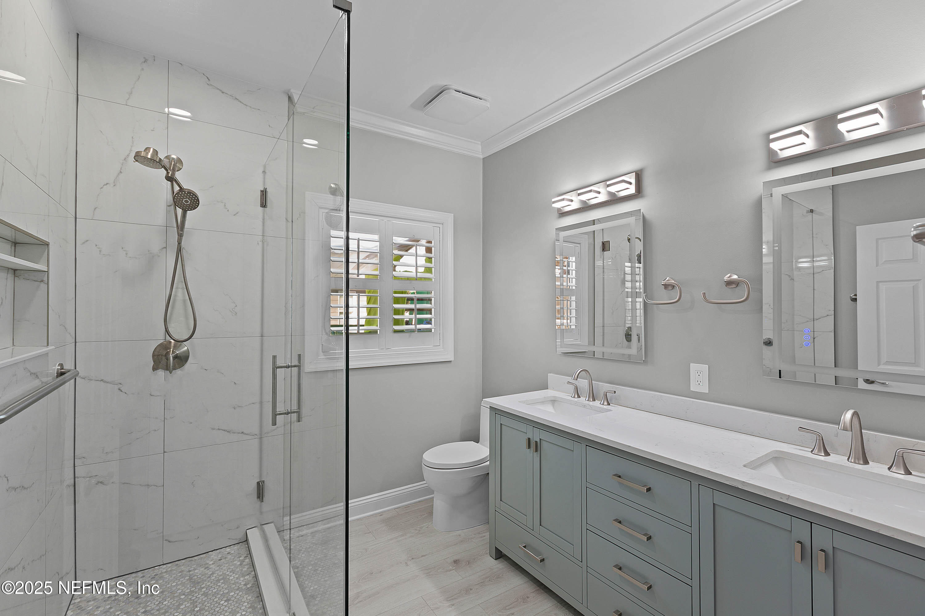 624 Ponte Vedra Boulevard, Unit C8 Ponte Vedra Beach, FL 32082 - Photo 16 of 26 a bathroom with a double vanity sink toilet mirror and shower