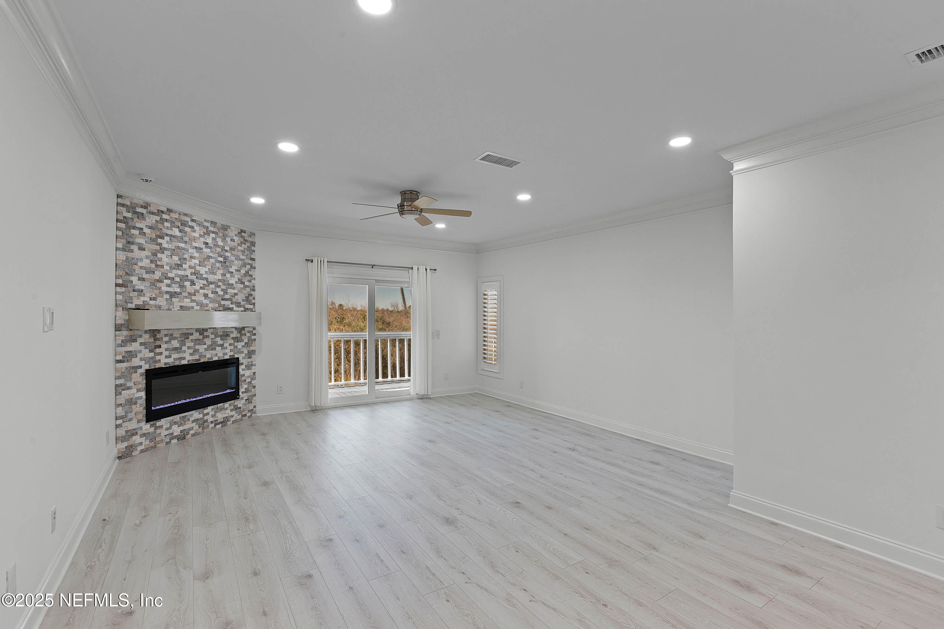 624 Ponte Vedra Boulevard, Unit C8 Ponte Vedra Beach, FL 32082 - Photo 9 of 26 a view of an empty room with wooden floor fireplace and a window