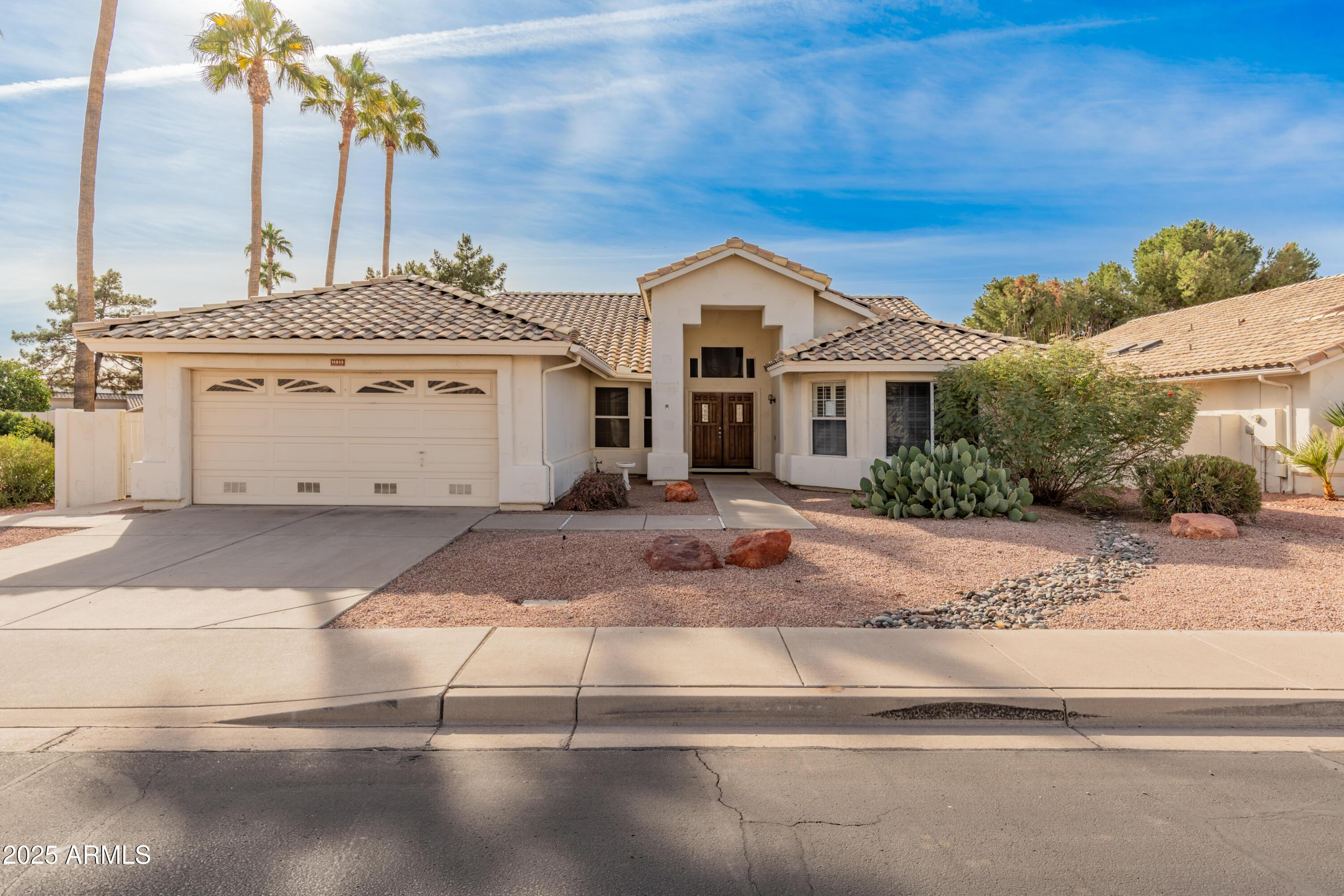 14543 West Bison Path Surprise, AZ 85374 - Photo 1 of 42 a front view of a house with a yard