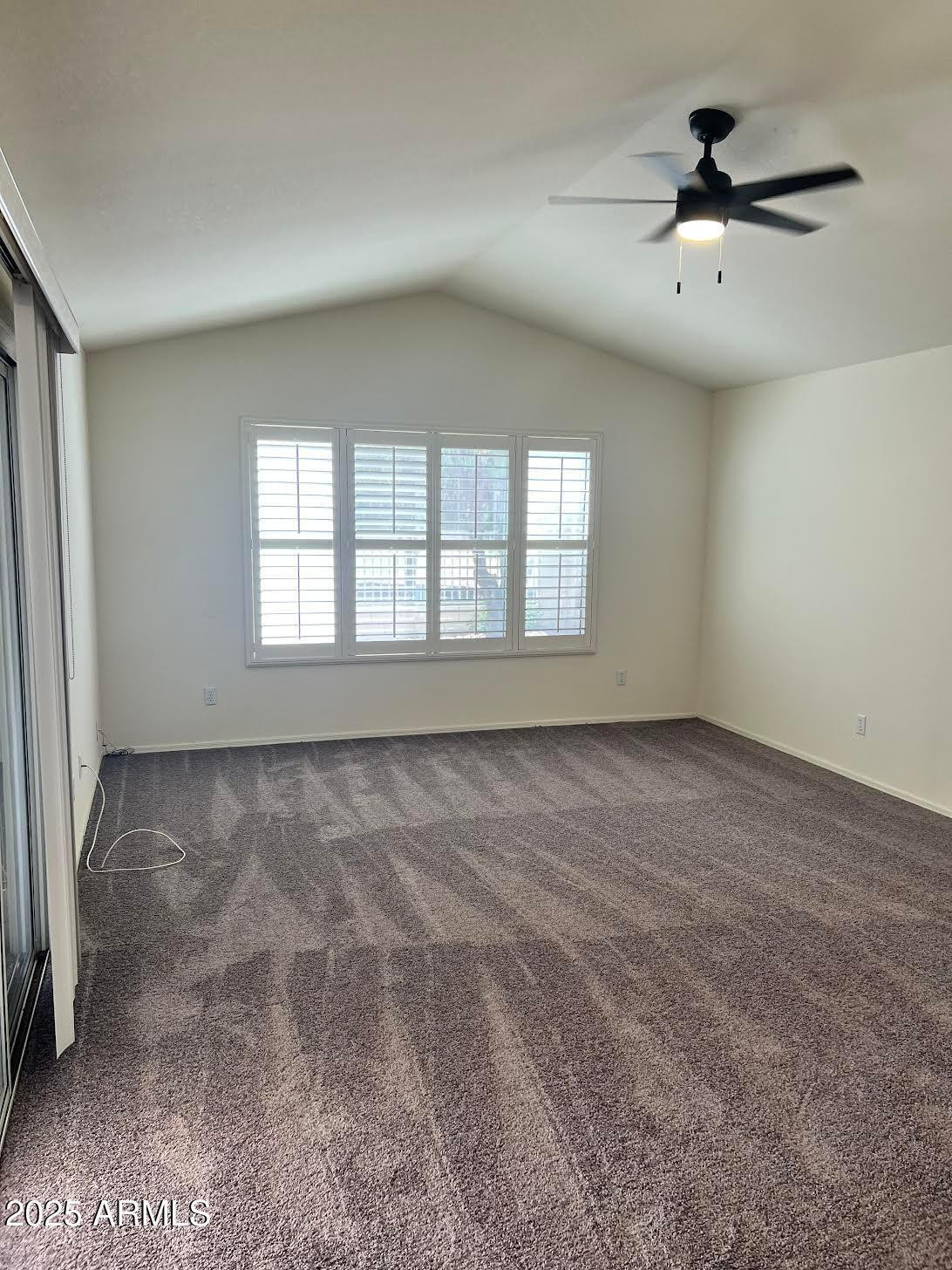 14543 West Bison Path Surprise, AZ 85374 - Photo 17 of 42 a view of an empty room with a window