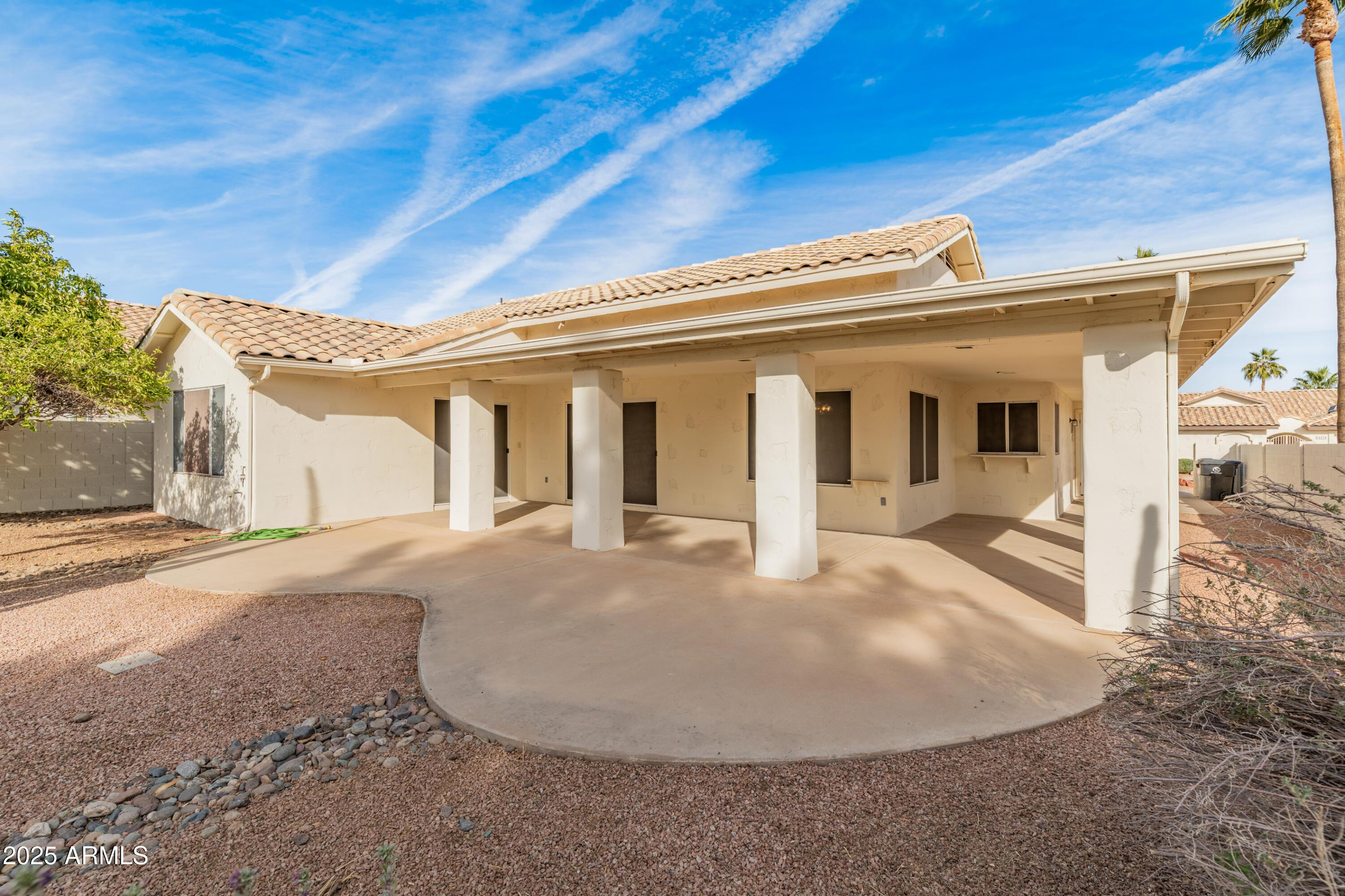 14543 West Bison Path Surprise, AZ 85374 - Photo 35 of 42 a view of a white house with a swimming pool