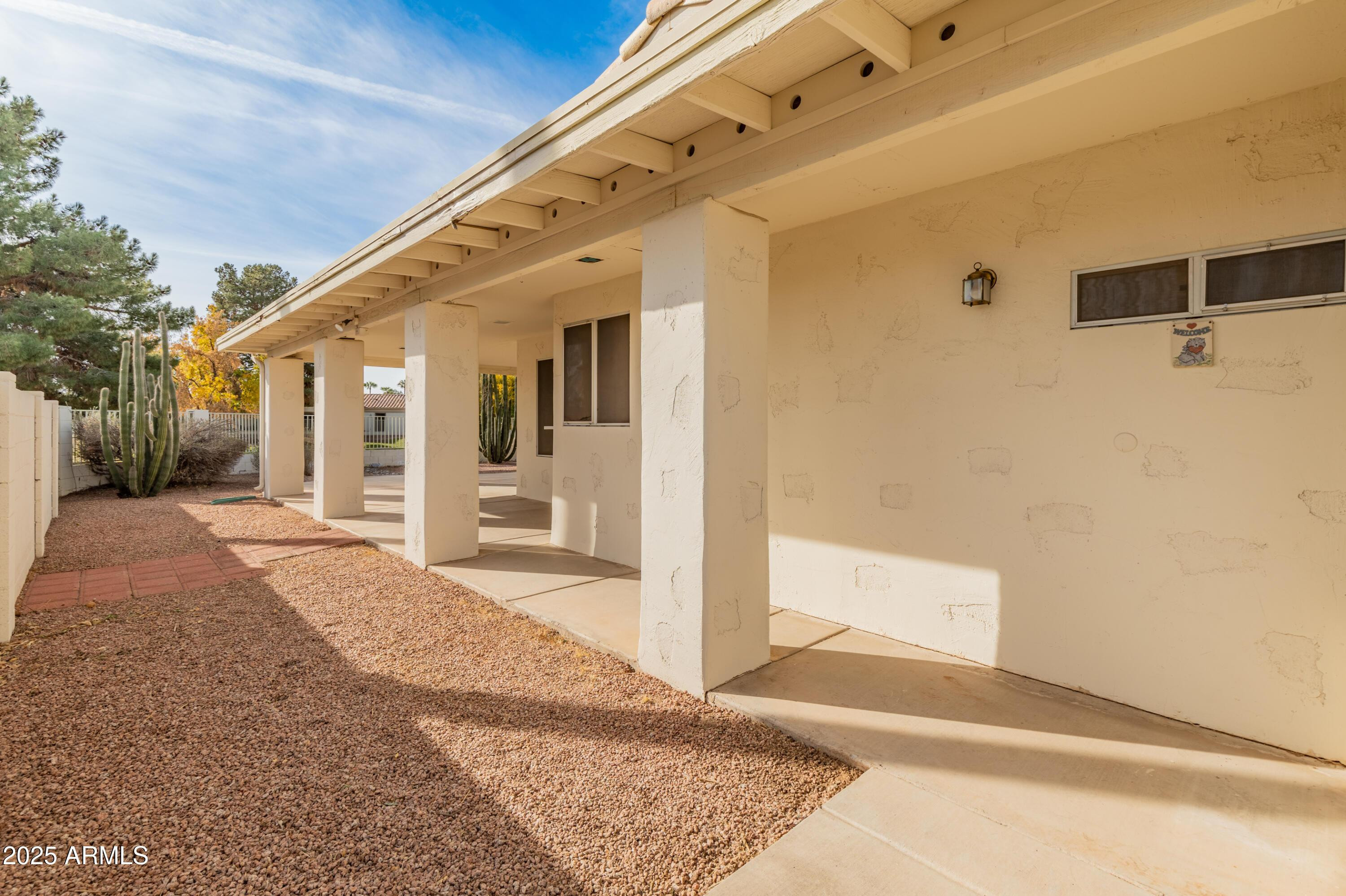 14543 West Bison Path Surprise, AZ 85374 - Photo 39 of 42 a front view of a house with a yard