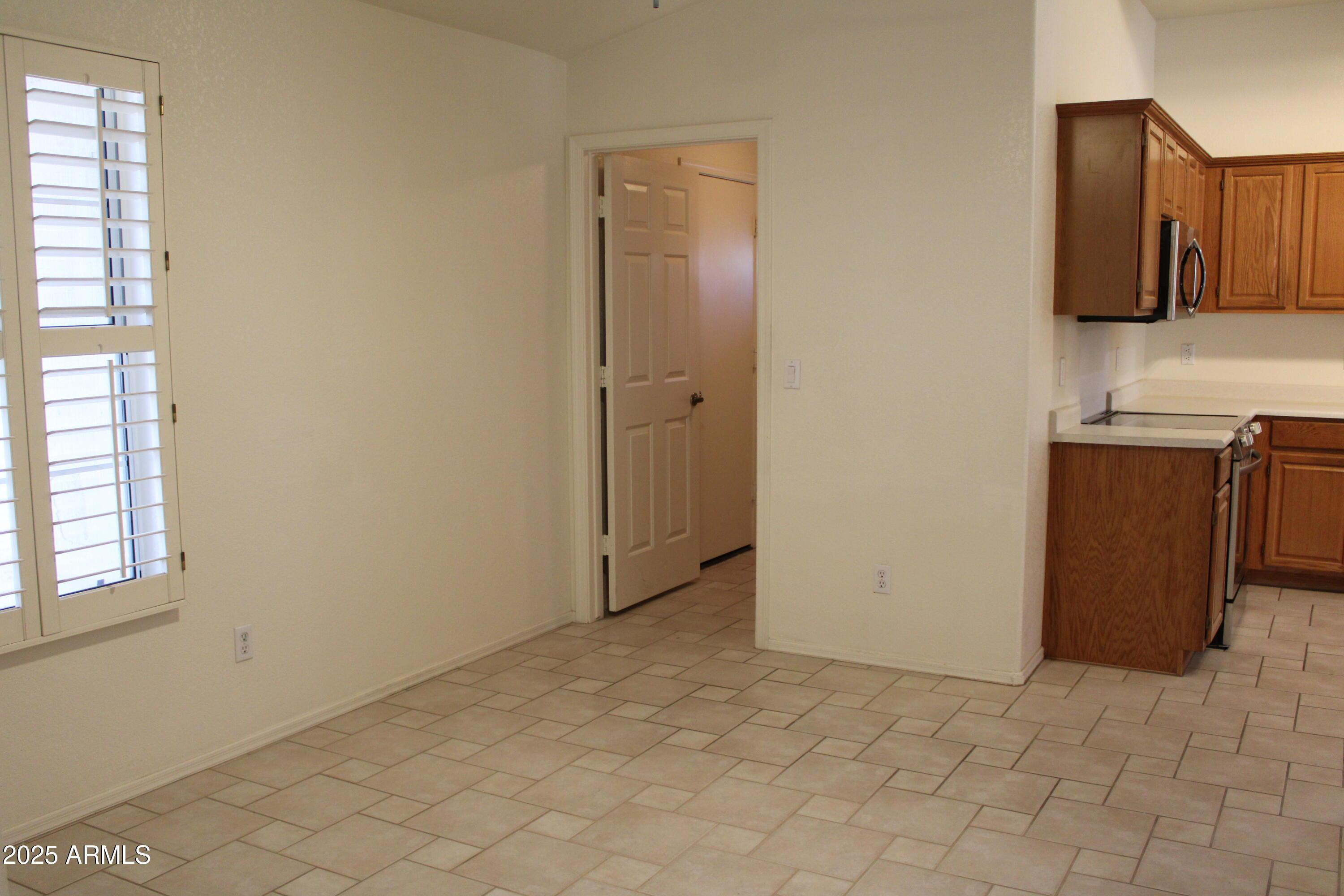 14543 West Bison Path Surprise, AZ 85374 - Photo 10 of 42 a view of a kitchen with a sink
