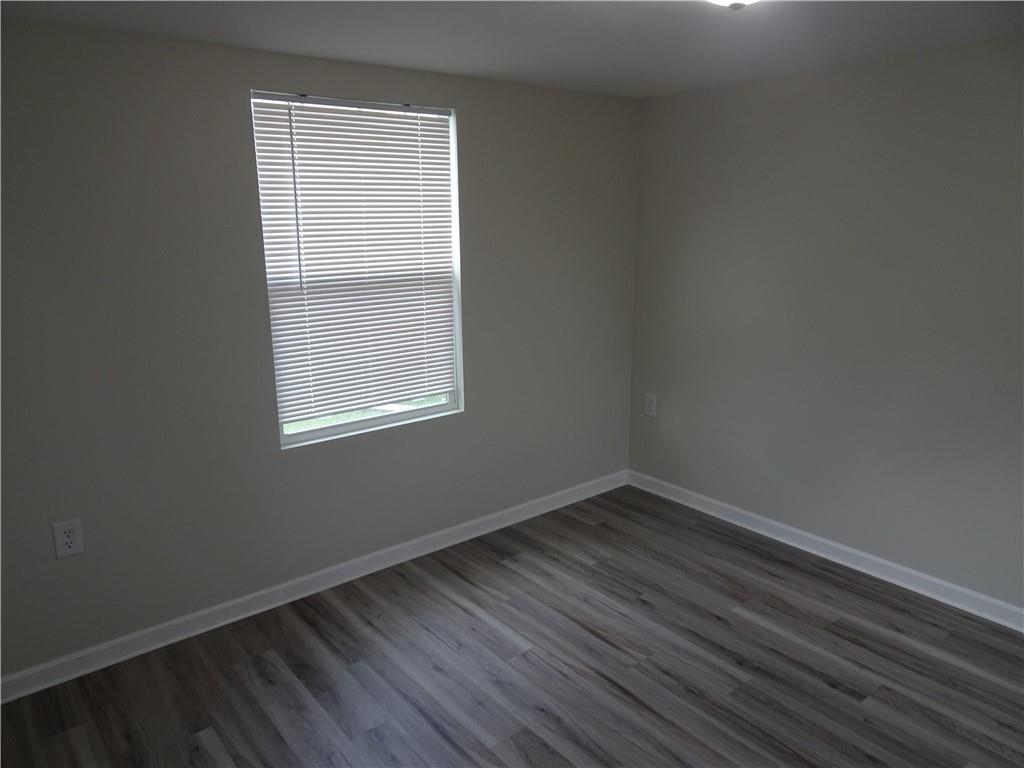 1530 Parr Street Greensburg, PA 15601 - Photo 11 of 16 a view of an empty room with wooden floor and a window