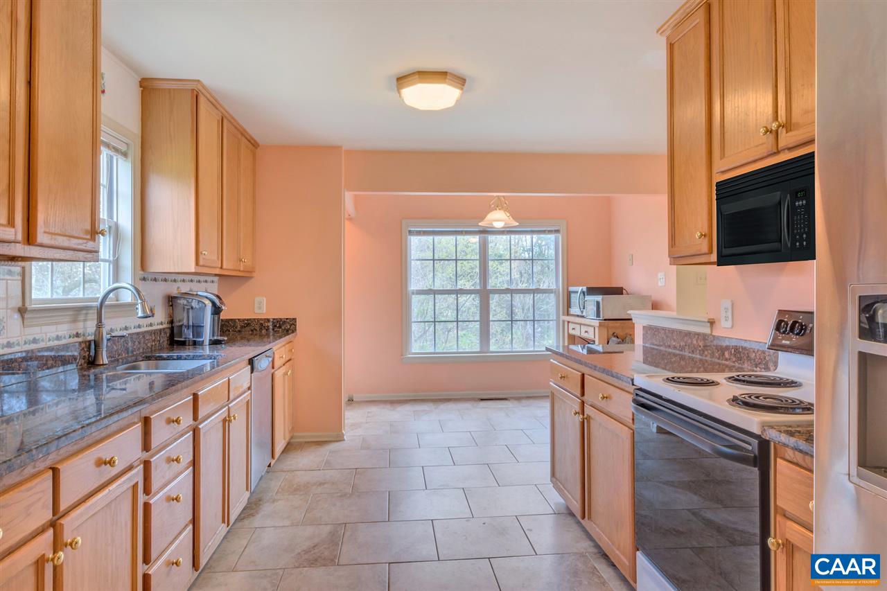 419 Valley View Road Ruckersville, VA 22968 - Photo 11 of 30 a kitchen with stainless steel appliances granite countertop a stove a sink and a microwave