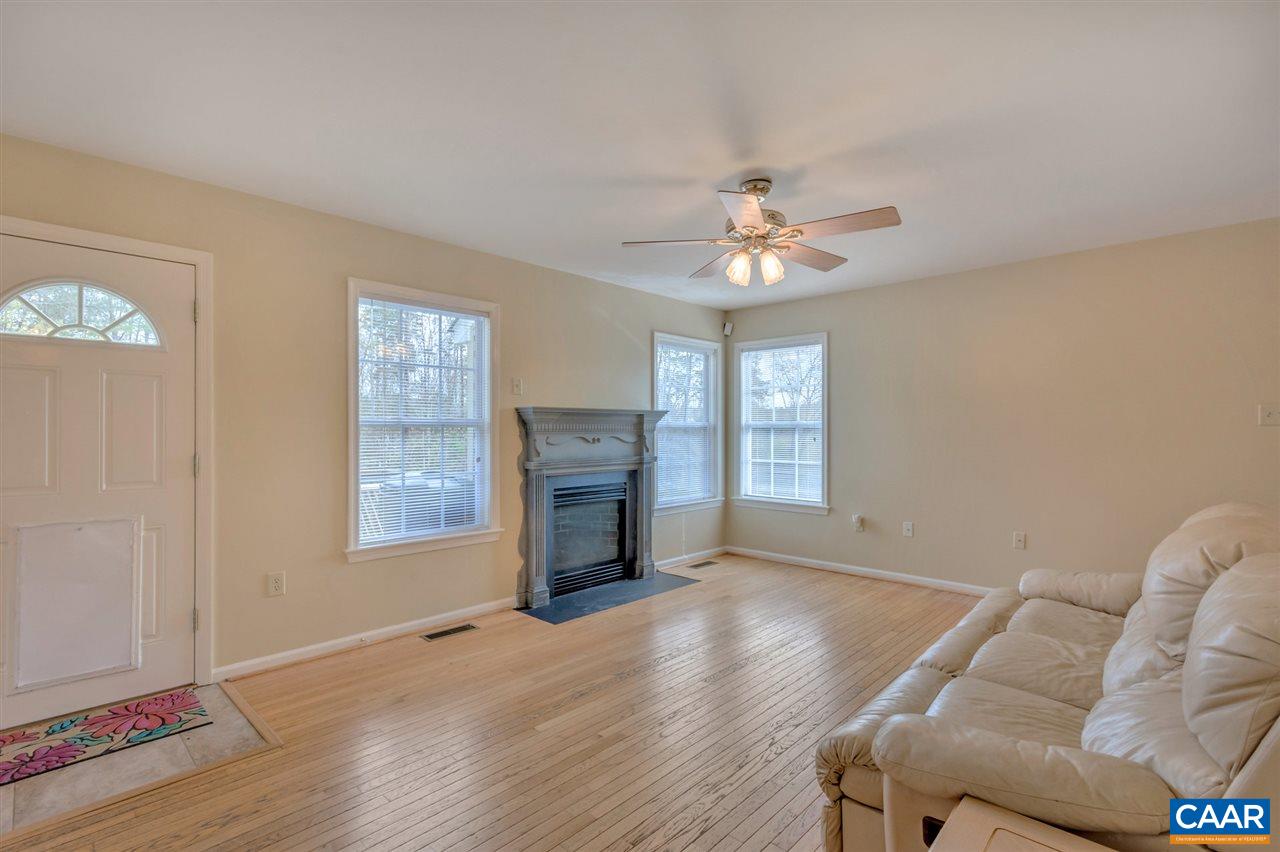 419 Valley View Road Ruckersville, VA 22968 - Photo 8 of 30 a living room with furniture a fireplace and a window