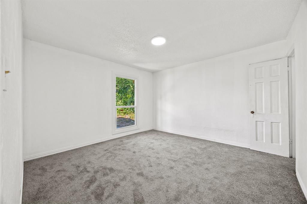 1802 Fordham Road Dallas, TX 75216 - Photo 23 of 25 an empty room with windows