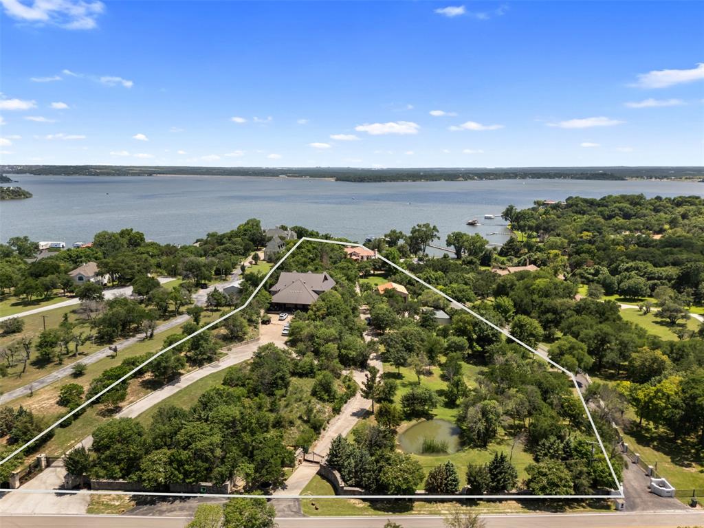 9930 Boat Club Road Fort Worth, TX 76179 - Photo 40 of 40 9930 Boat Club Road includes a stunning primary residence, private dock, Guest Cottage, Hill Lodge, two shops, and a pond. Enjoy the scenic views of Eagle Mountain Lake!