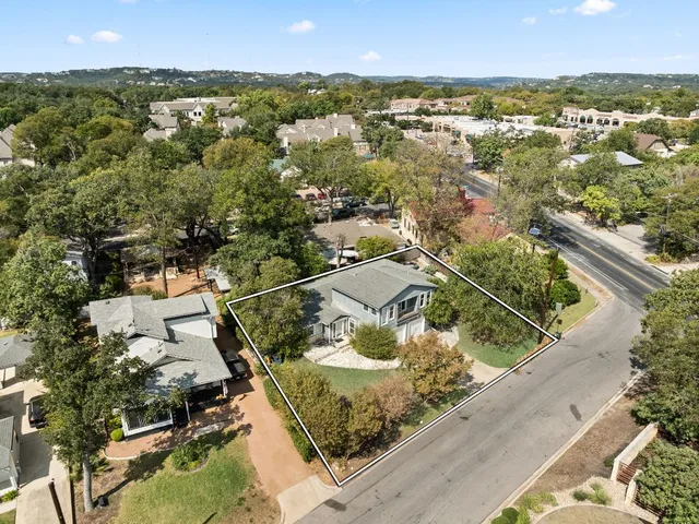 an aerial view of residential houses with outdoor space