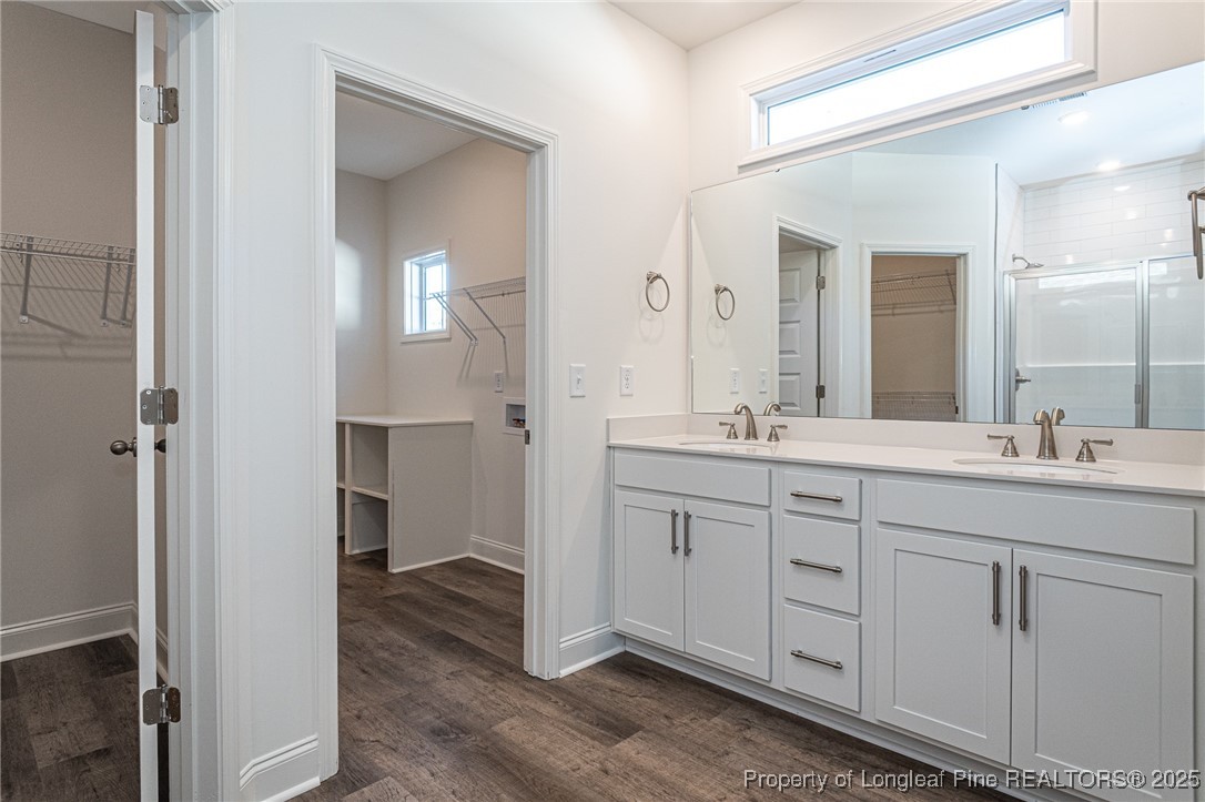 3211 Nottinghill Road Fayetteville, NC 28311 - Photo 13 of 39 a spacious bathroom with a granite countertop sink mirror and a
