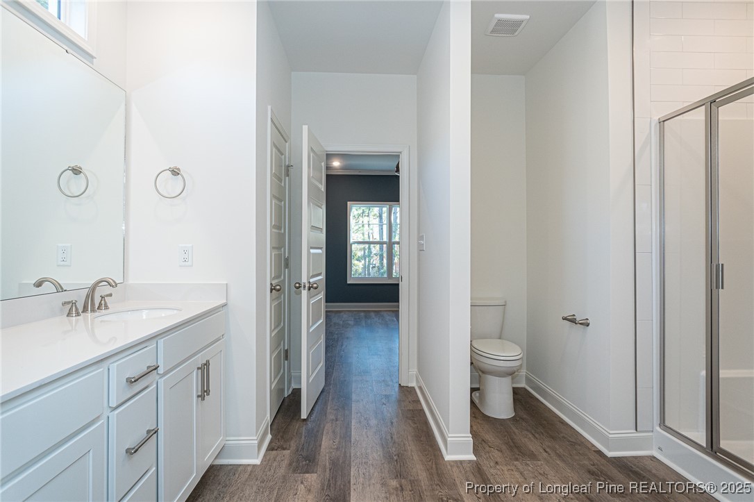 3211 Nottinghill Road Fayetteville, NC 28311 - Photo 14 of 39 a spacious bathroom with a granite countertop sink toilet and shower