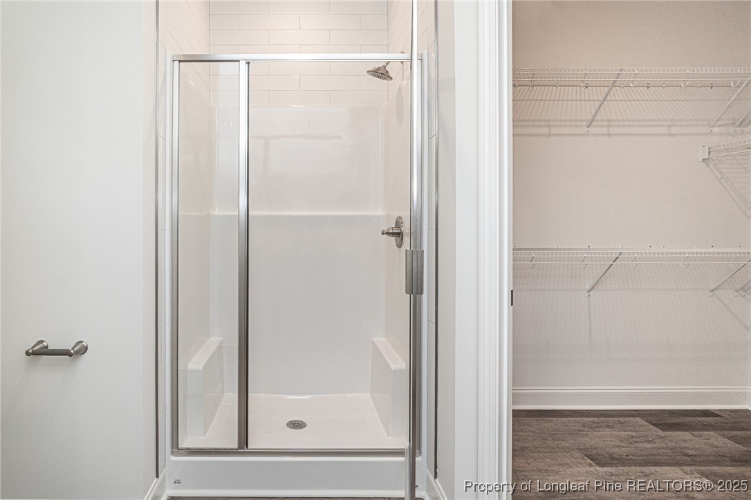 3211 Nottinghill Road Fayetteville, NC 28311 - Photo 15 of 39 a bathroom with a glass shower door