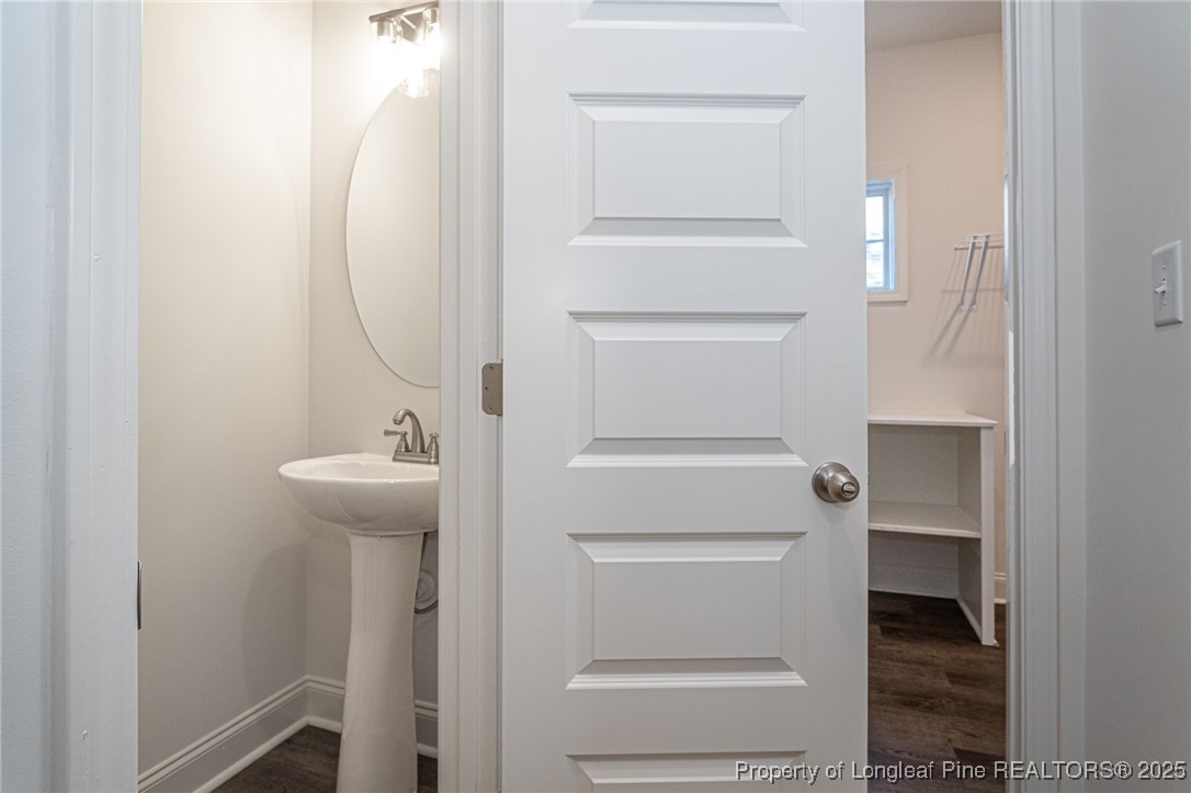 3211 Nottinghill Road Fayetteville, NC 28311 - Photo 19 of 39 a bathroom with a sink and mirror