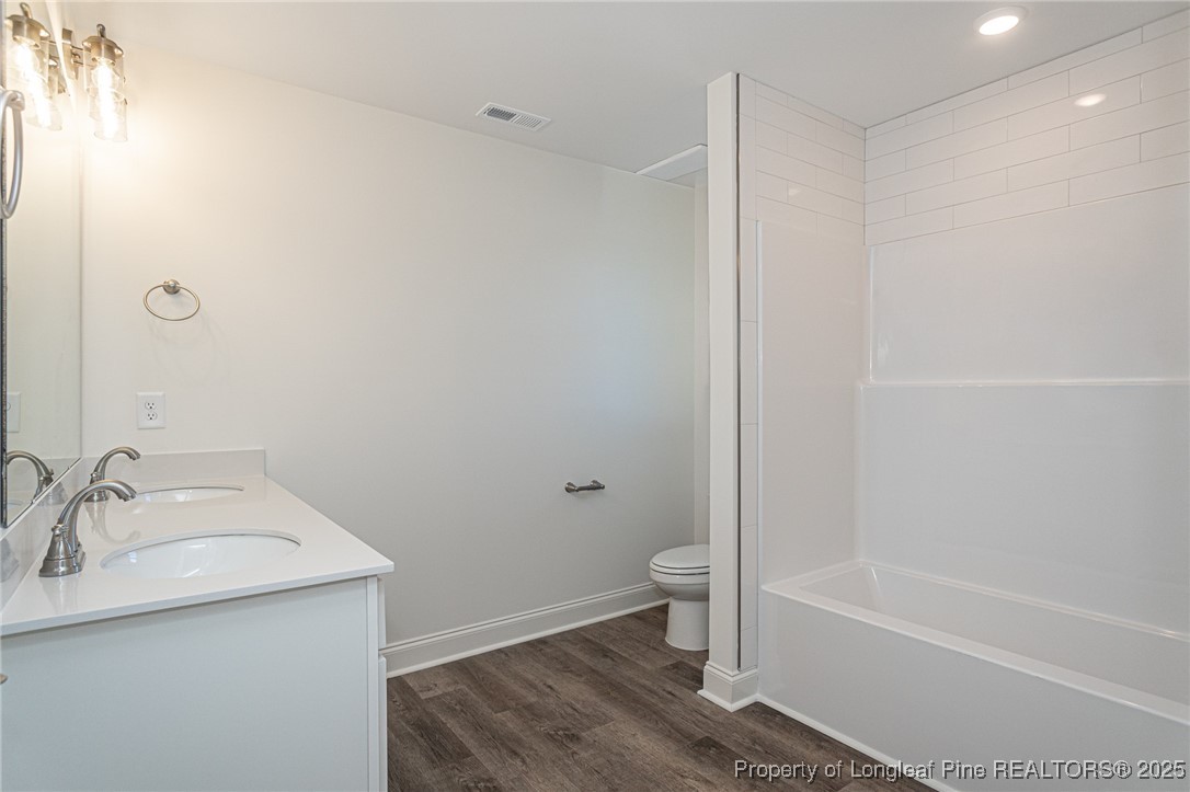 3211 Nottinghill Road Fayetteville, NC 28311 - Photo 30 of 39 a bathroom with a sink toilet and shower