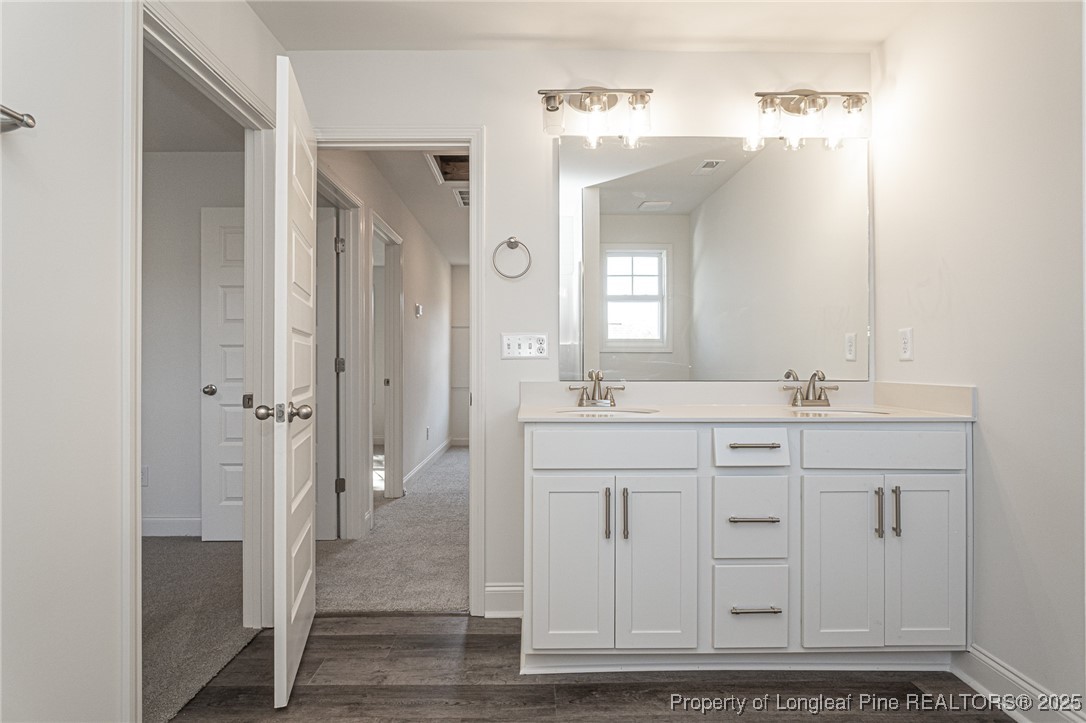3211 Nottinghill Road Fayetteville, NC 28311 - Photo 32 of 39 a bathroom with a double vanity sink mirror and shower