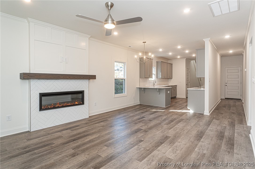 3211 Nottinghill Road Fayetteville, NC 28311 - Photo 6 of 39 a view of a room with kitchen and fireplace