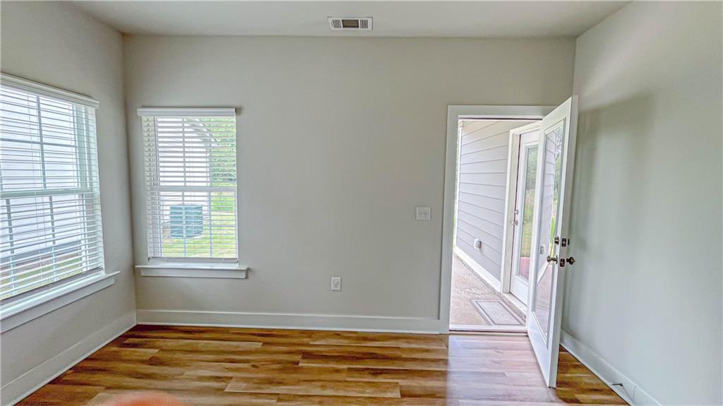 740 Eudora Welty Way Athens, GA 30607 - Photo 36 of 57 a view of an empty room with wooden floor and a window