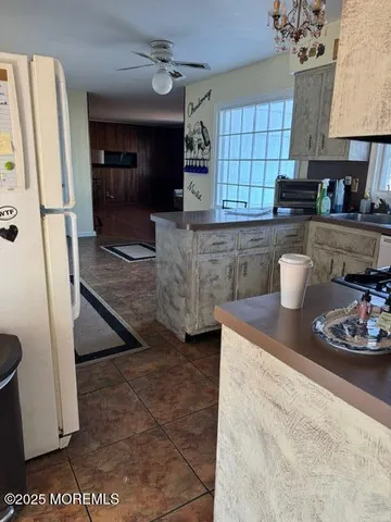 a kitchen with a sink and a refrigerator