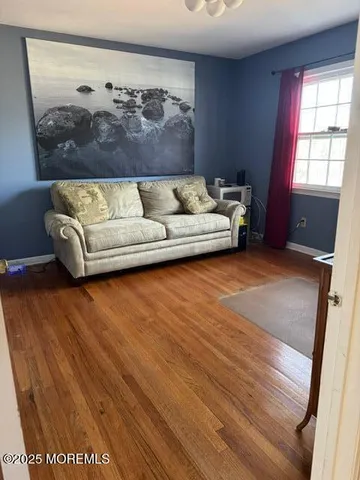 a living room with a couch and window