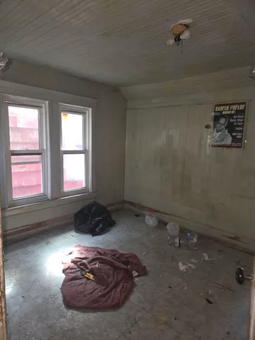 a room with a bed and a window