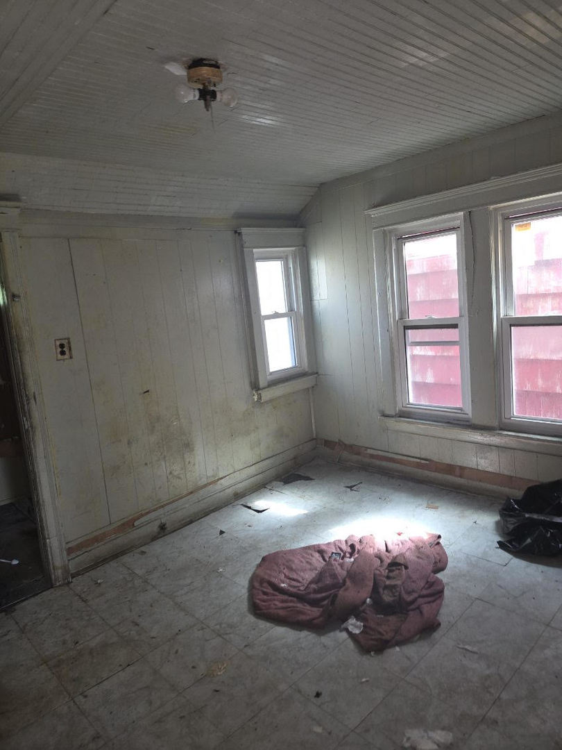 6619 South Aberdeen Street Chicago, IL 60621 - Photo 17 of 17 an empty room with windows
