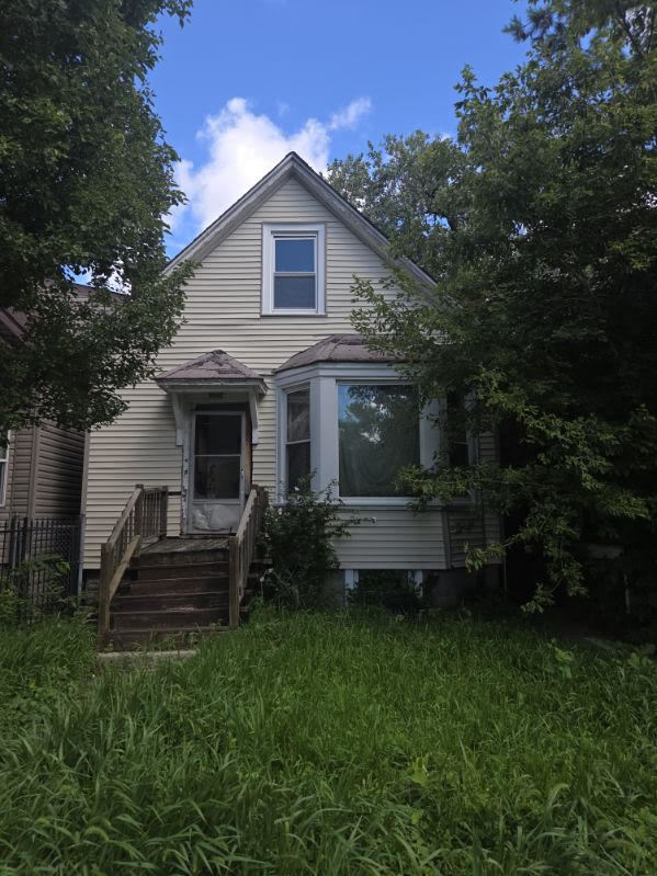 6619 South Aberdeen Street Chicago, IL 60621 - Photo 2 of 17 a front view of a house with garden