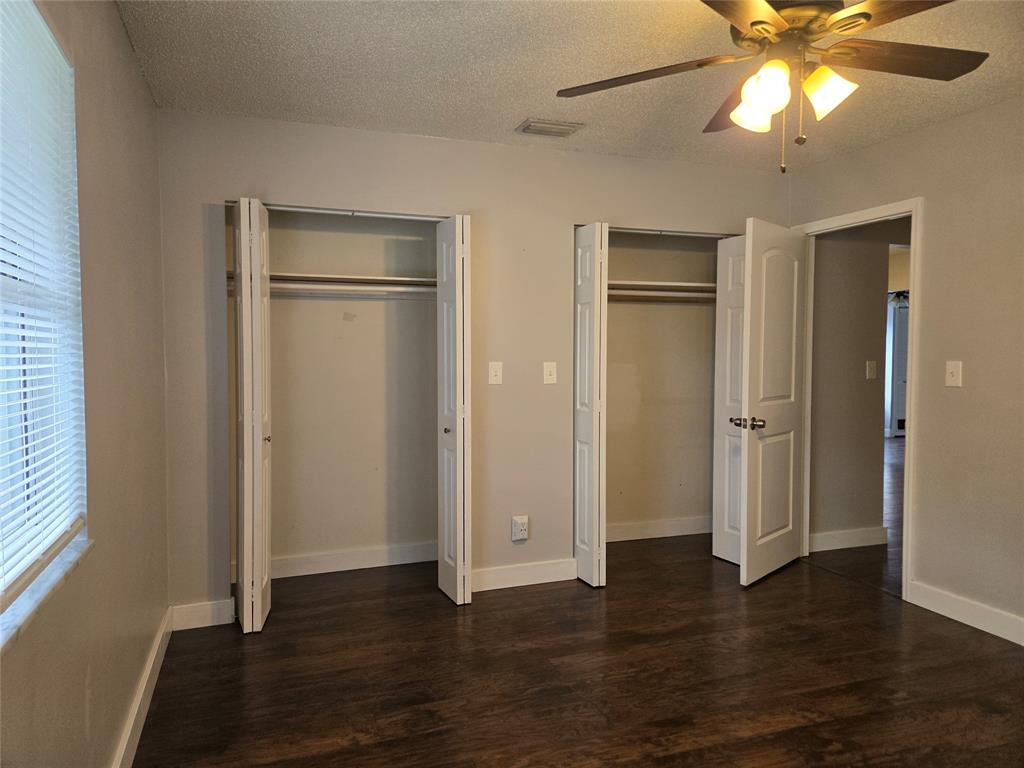 3559 Almar Road Palm Springs, FL 33461 - Photo 11 of 16 an empty room with wooden floor closet and windows