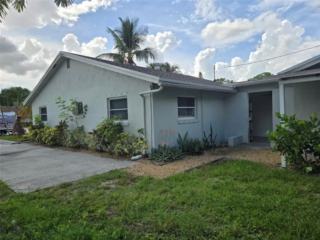 a house view with a garden space