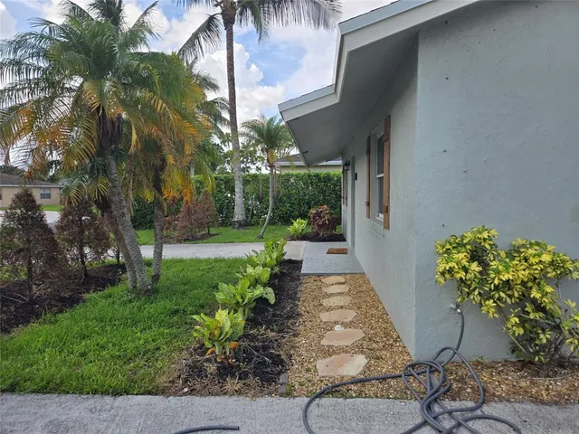 a view of a backyard with garden