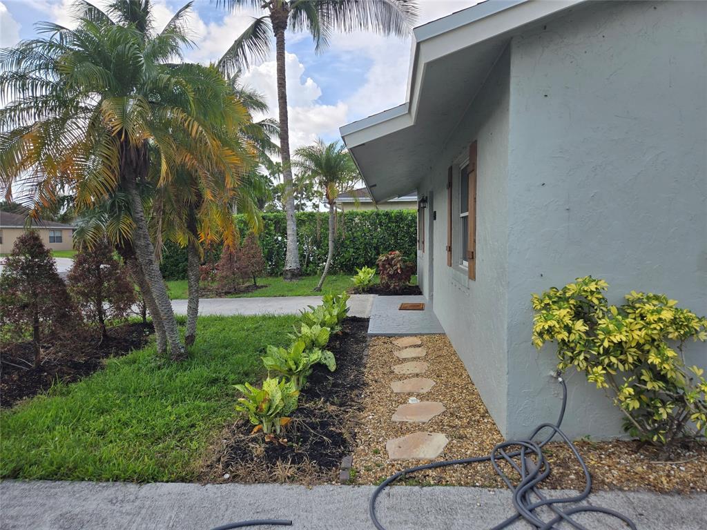 3559 Almar Road Palm Springs, FL 33461 - Photo 16 of 16 a view of a backyard with garden