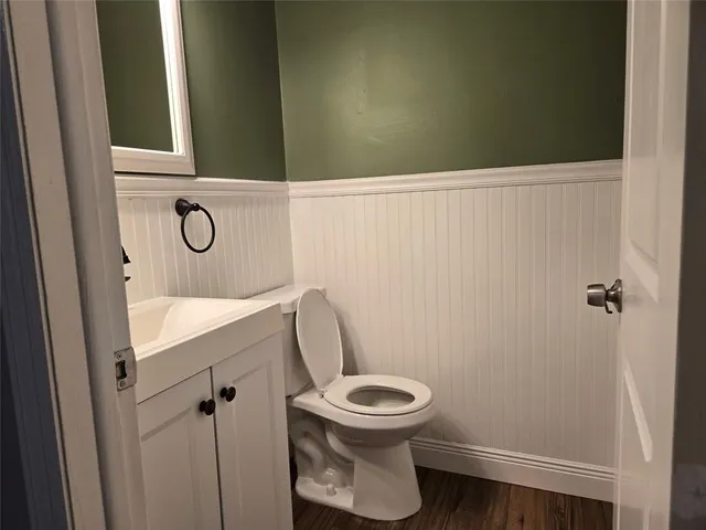 a bathroom with a toilet and a sink