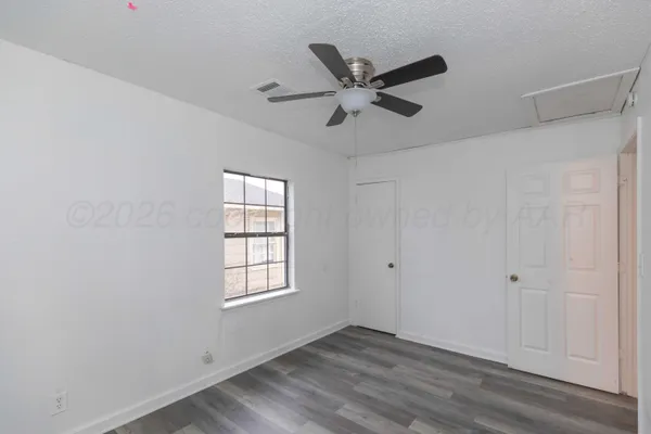 a view of an empty room and window