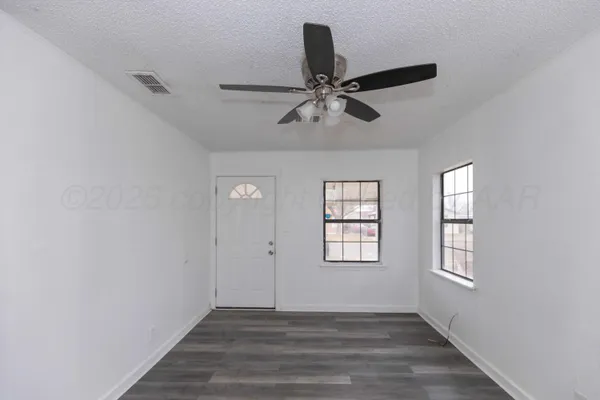 a kitchen that has a sink and a stove