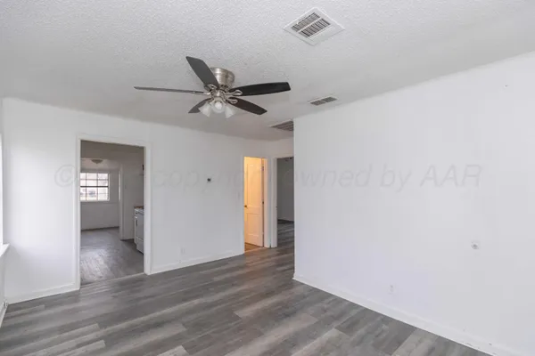 a kitchen that has a sink and cabinets