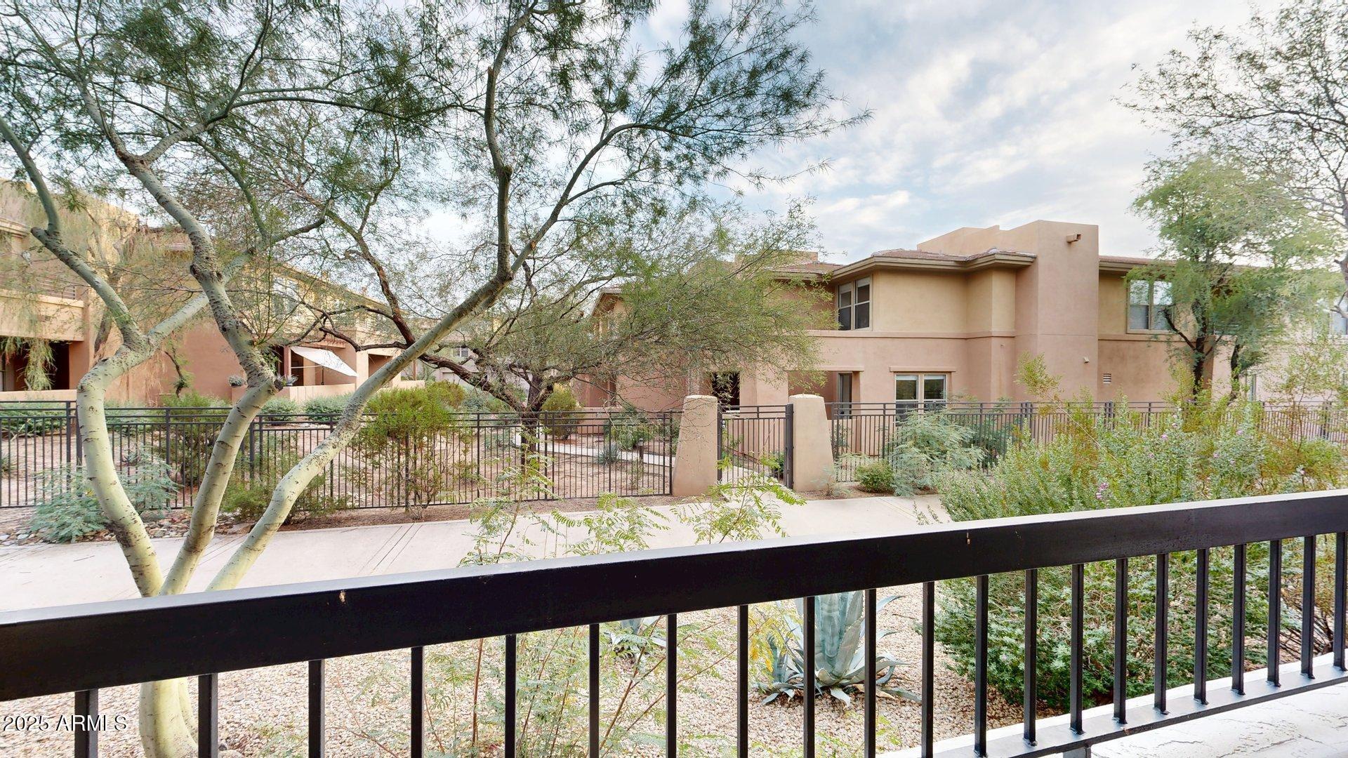 20121 North 76th Street, Unit 1047 Scottsdale, AZ 85255 - Photo 22 of 22 a view of a house with large trees