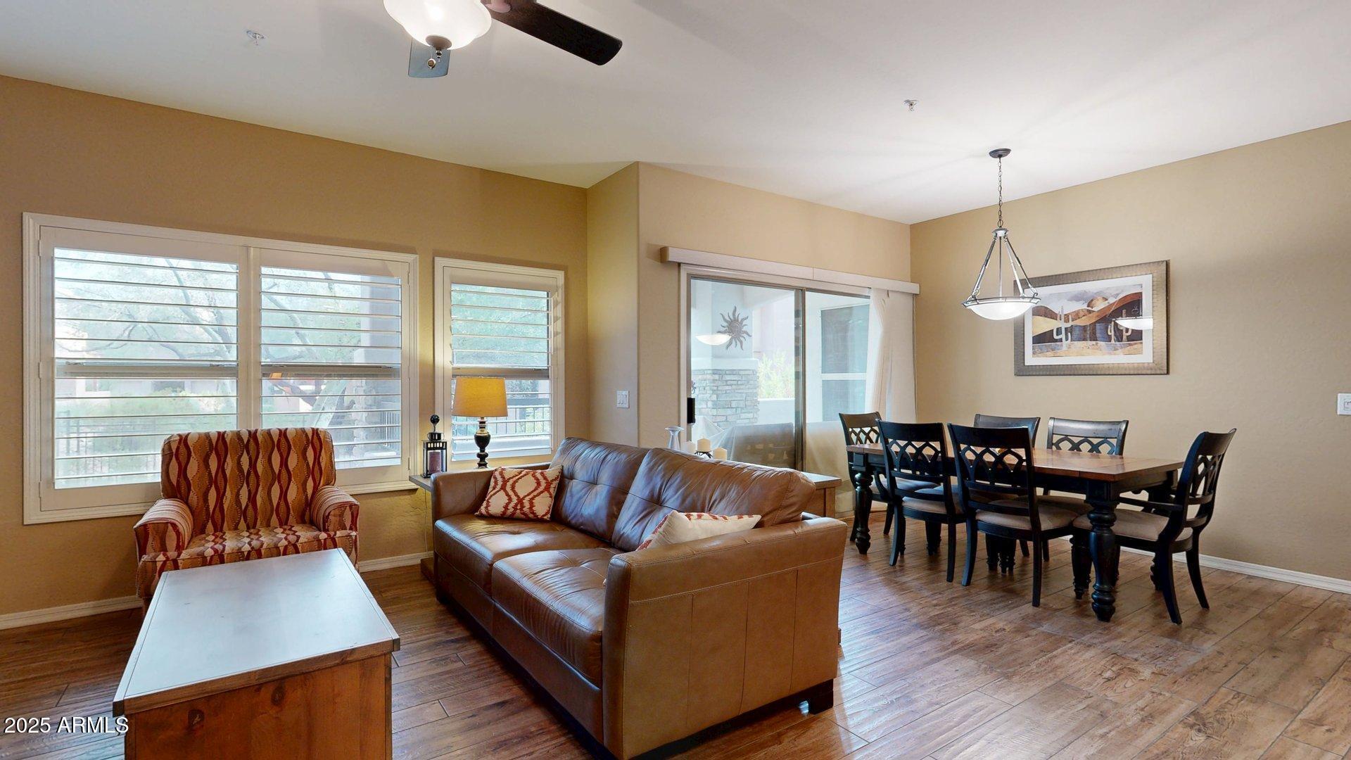 20121 North 76th Street, Unit 1047 Scottsdale, AZ 85255 - Photo 6 of 22 a living room with furniture and wooden floor