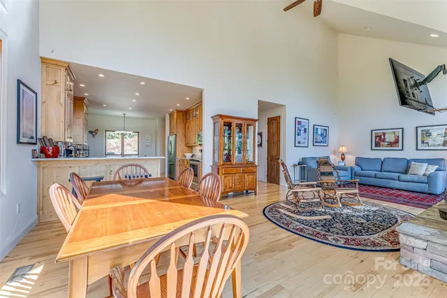 a living room with fireplace furniture and a wooden floor