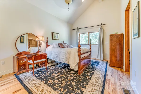 a bed room with a bed and a dresser