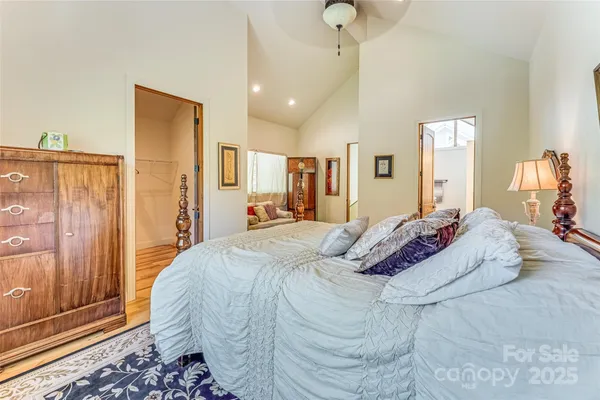 a bed room with a bed and a mirror