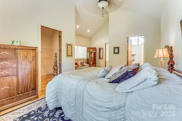 a bed room with a bed and a mirror