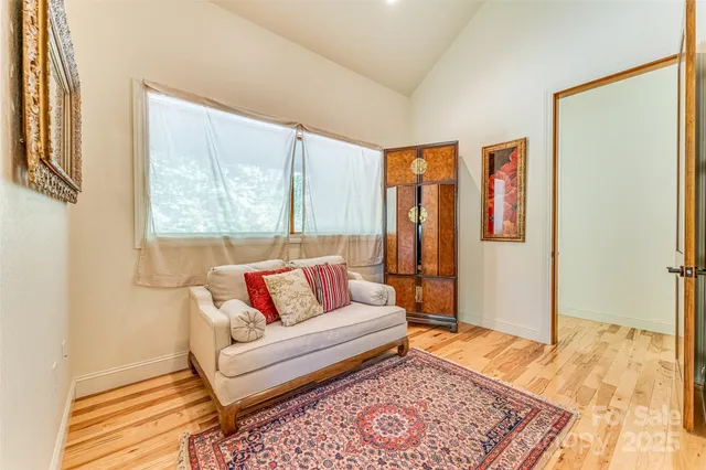 a living room with furniture and a rug